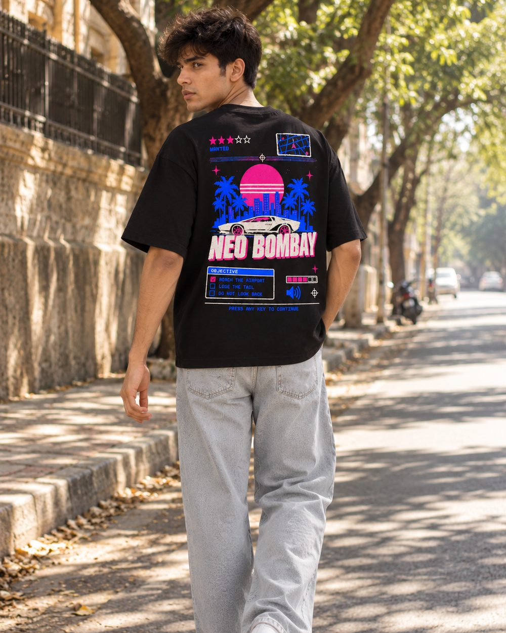 Neo Bombay tee, full back print, walking down a tree-lined lane