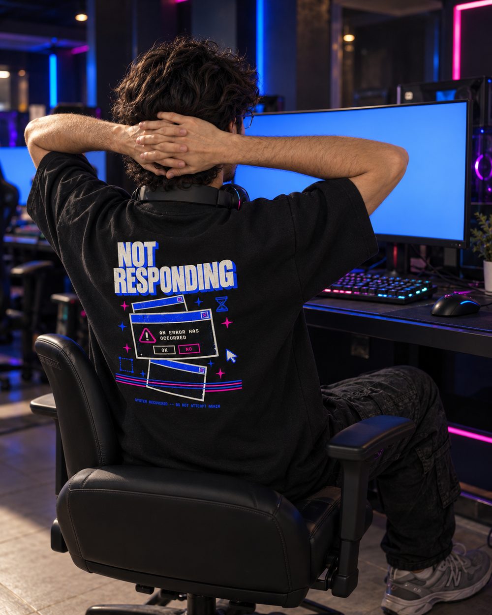 Not Responding tee, full back print, leaning back in a gaming chair