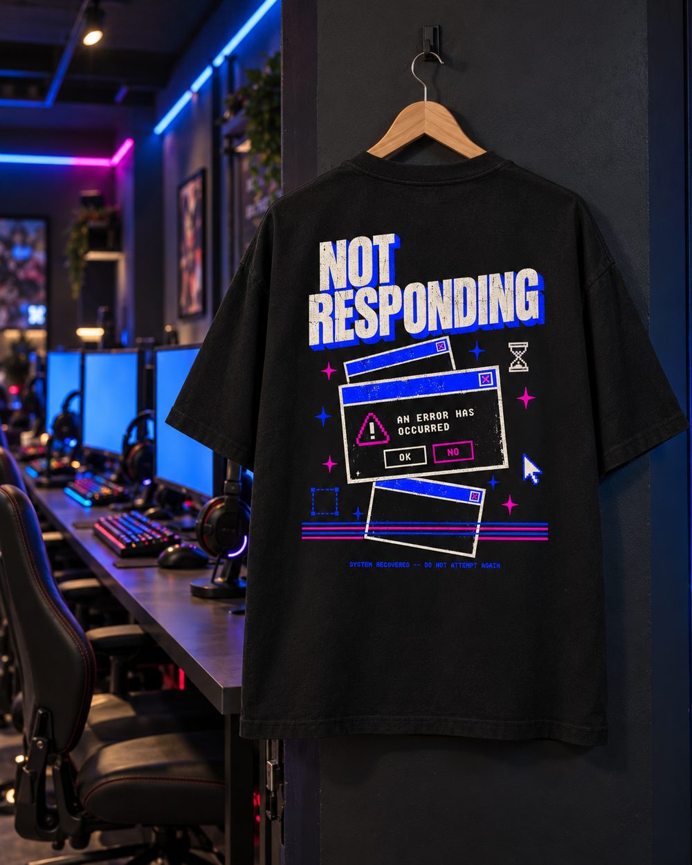 Not Responding tee on a hanger in a neon-lit gaming room, back print